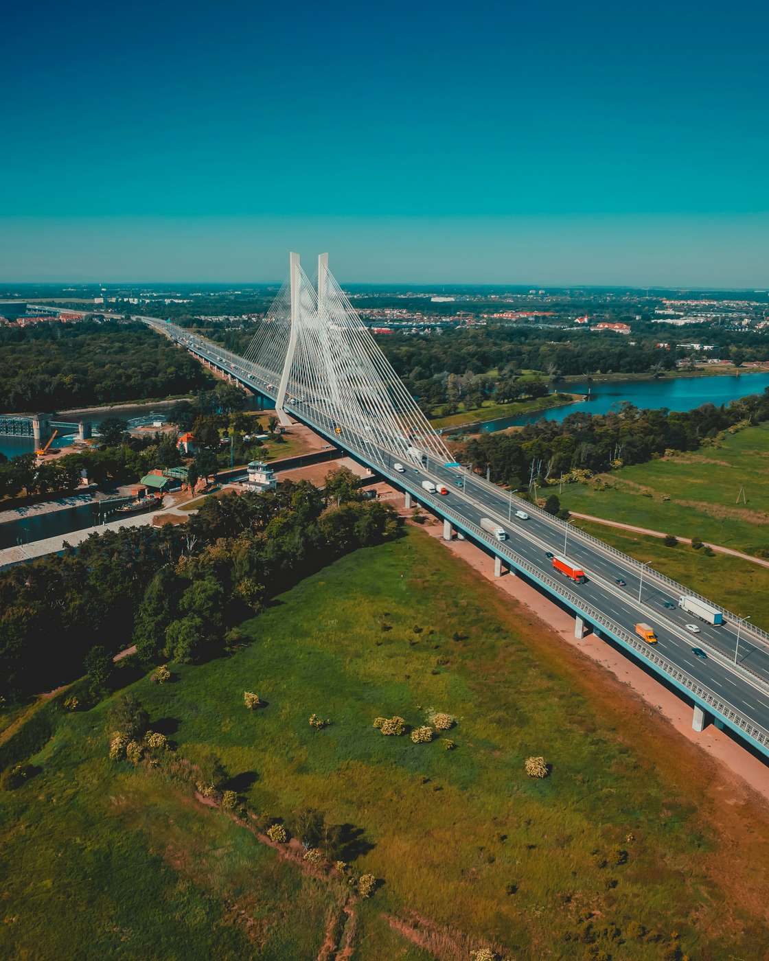 The Rędziński Bridge on Wrocław's motorway ring with lorries crossing, from above